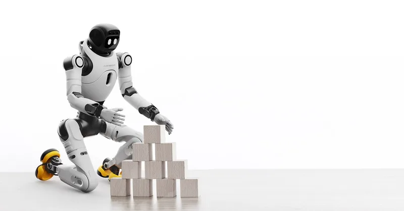 Робот-гуманоид AgiBot X2 — на одном колене рядом с кубиками